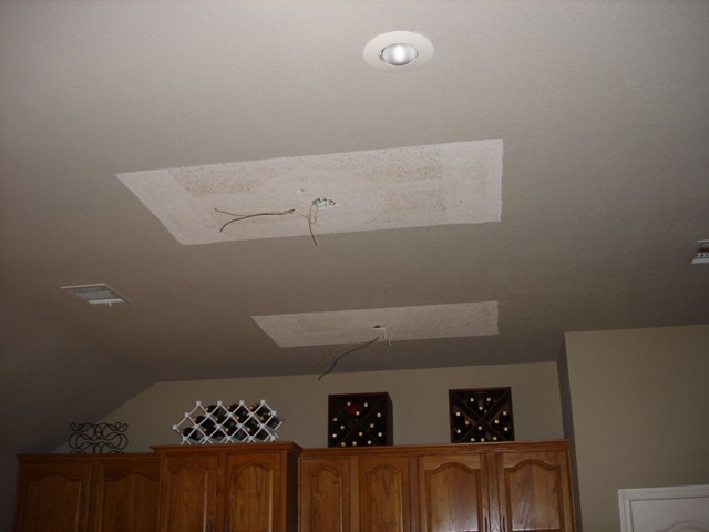  replacing the fluorescent lights in the kitchen with recessed lights.